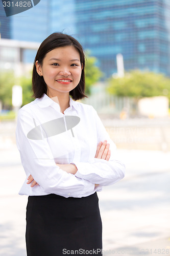 Image of Young Asian female executive smiling portrait