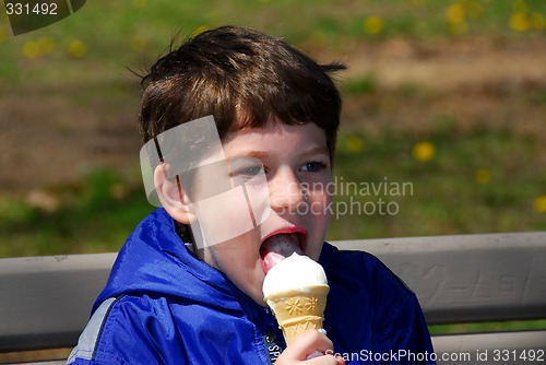 Image of Boy licking ice cream