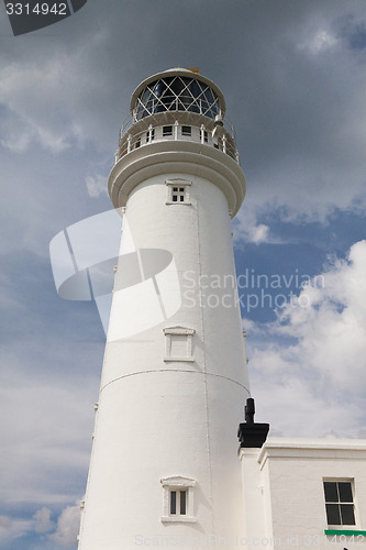 Image of White lighthouse on Flamborough Head in England.