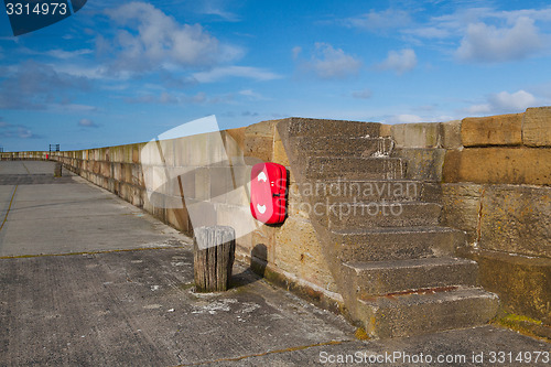 Image of Empty pier in Scarborough harbor.