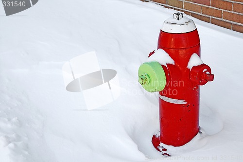 Image of Red fire hydrant in the snow