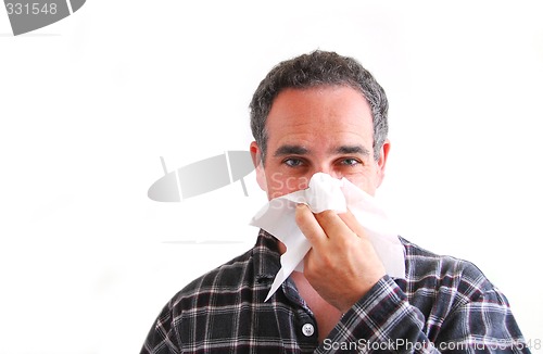 Image of Man with cold blowing nose