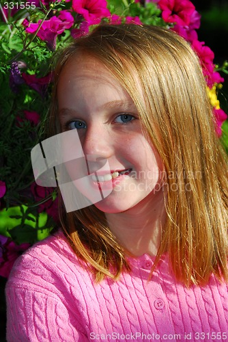 Image of Young girl with flowers, portrait