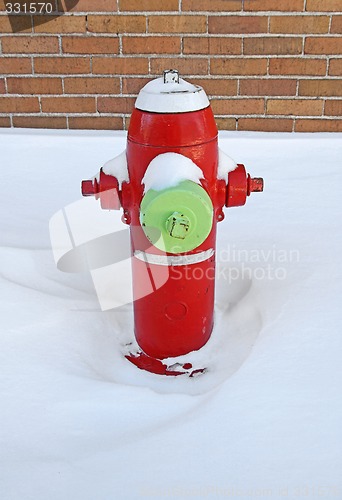 Image of Red fire hydrant covered by snow