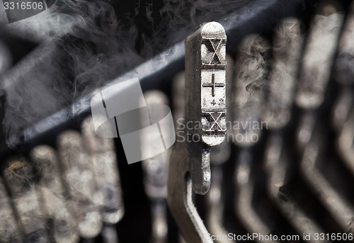 Image of X hammer - old manual typewriter - mystery smoke