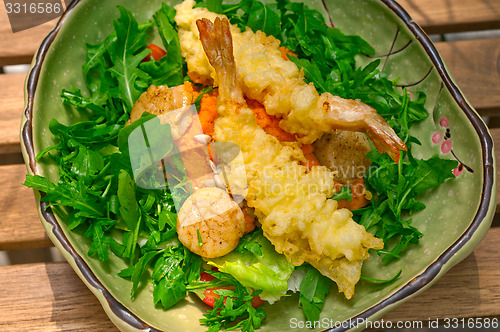 Image of fresh Japanese tempura shrimps with salad