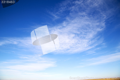 Image of the sunrise in  colored sky white desert  background