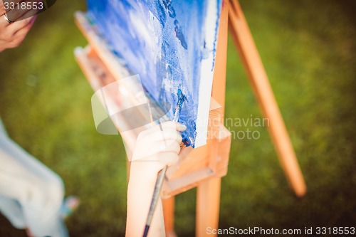 Image of Mother and little daughter paint together