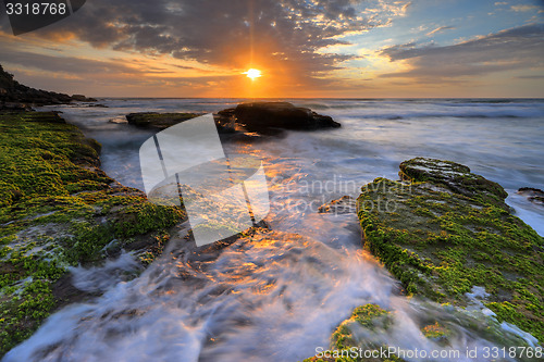 Image of Ocean flows around the rocks at Bungan Beach
