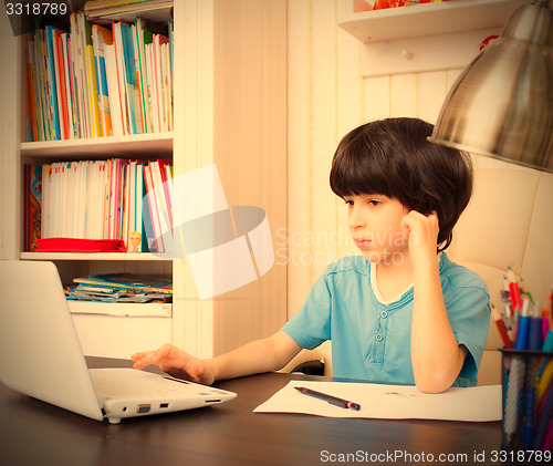 Image of boy doing homework, portrait