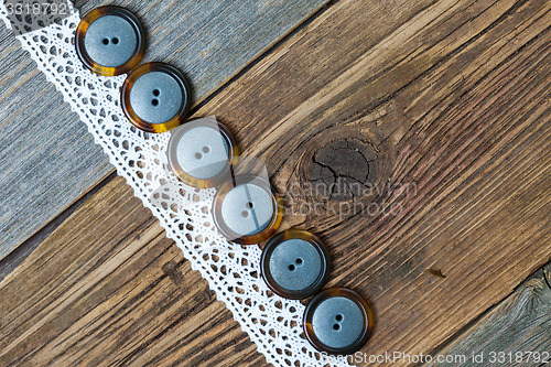 Image of vintage buttons and antique lace