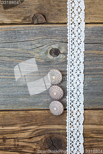 Image of Three vintage bone buttons and lace tape