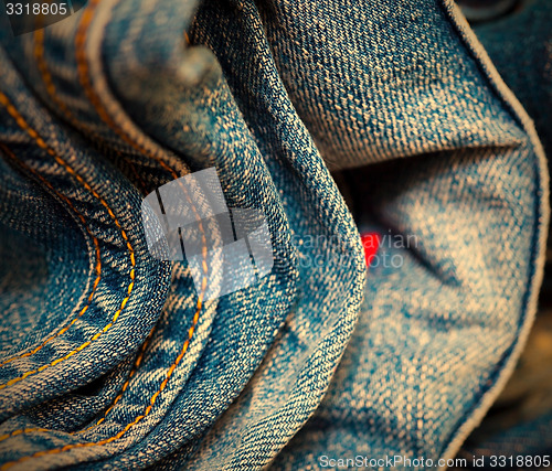 Image of stitching on blue jeans