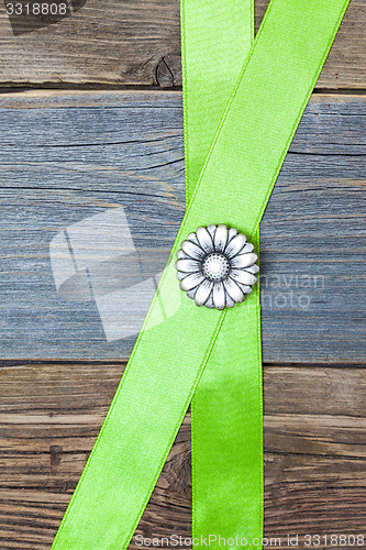 Image of Vintage metal button flower and two green tape