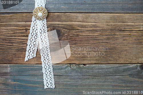 Image of vintage lace with a brooch