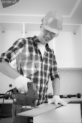 Image of worker with jigsaw