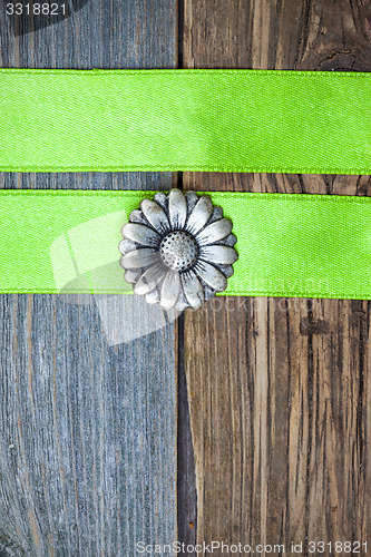 Image of vintage button flower and two green tapes