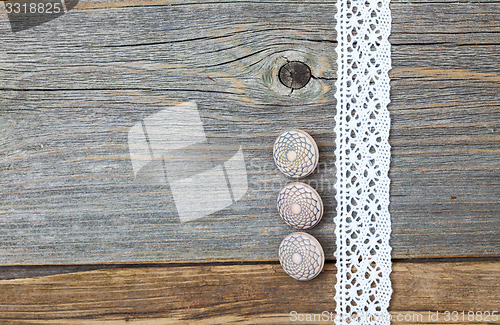 Image of Three vintage bone buttons and lace tape