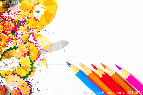 Image of Four colored pencils and shavings