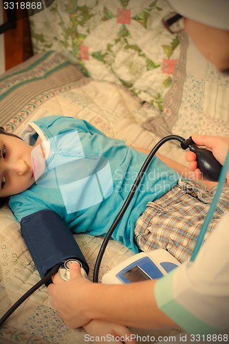 Image of Doctor measure blood pressure