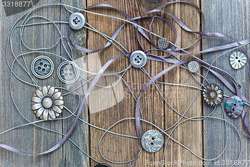 Image of buttons, lace and ribbons