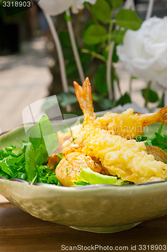 Image of fresh Japanese tempura shrimps with salad