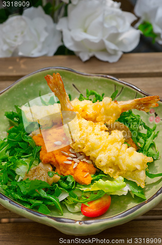 Image of fresh Japanese tempura shrimps with salad