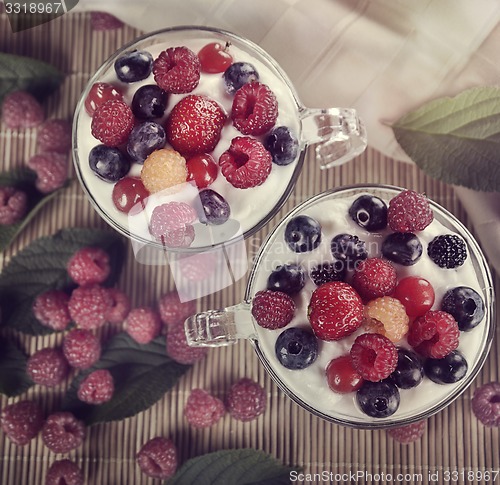 Image of Two Cups Of Yogurt With Berries