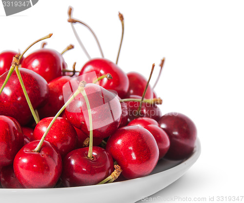 Image of Closeup red sweet cherries in white plate