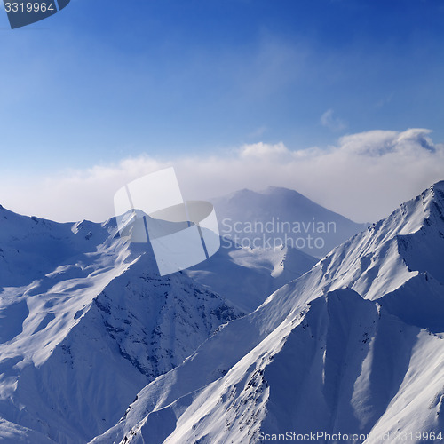 Image of Snowymountains in early morning fog