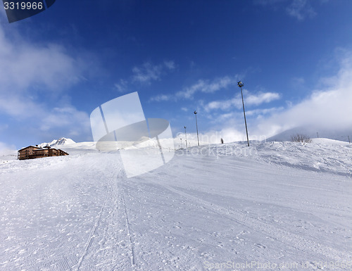 Image of Ski slope and hotel in winter mountains