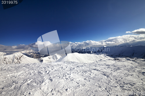 Image of Wide-angle view on off-piste slope and snowy mountains