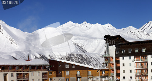 Image of Snowy hotels in winter mountains at nice day