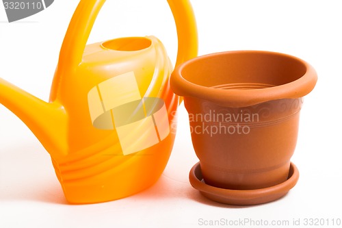 Image of Watering can and pot    