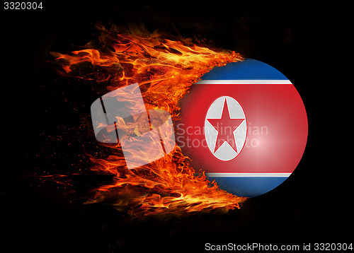 Image of Flag with a trail of fire - North Korea