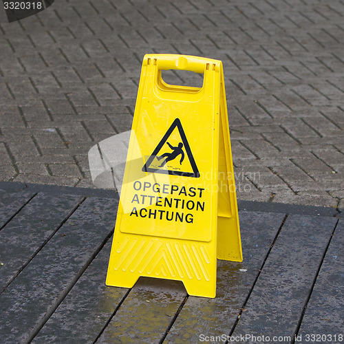 Image of Watch your step sign on the floor