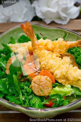 Image of fresh Japanese tempura shrimps with salad