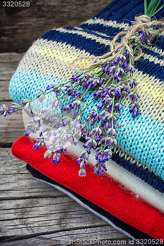 Image of branches of blooming lavender and wool items
