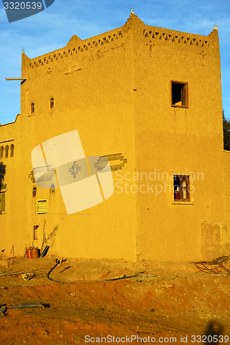 Image of old brown construction in  morocco and sky  near the tower
