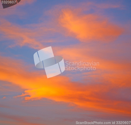 Image of the sunrise in  colored sky white soft clouds and abstract backg