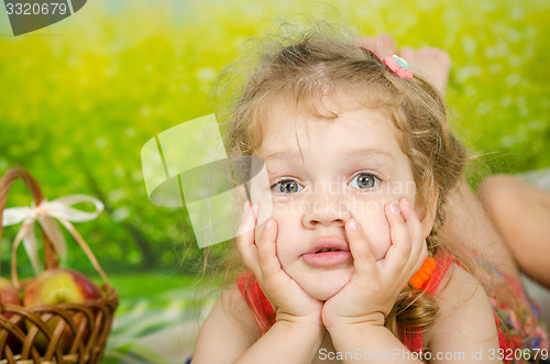 Image of Funny three year old girl on a picnic