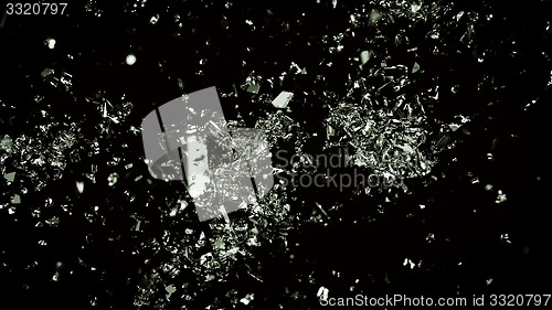 Image of Pieces of cracked glass on black