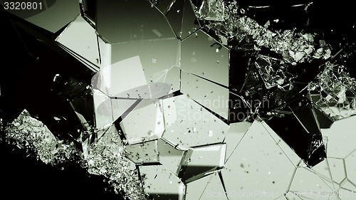 Image of Pieces of broken or cracked glass on black