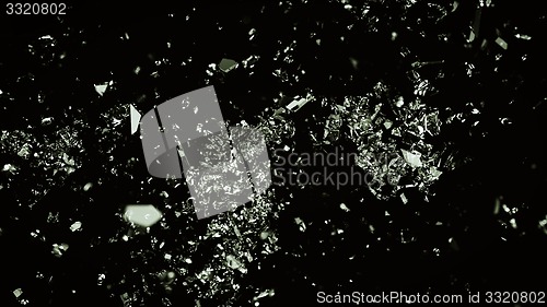 Image of Small Pieces of splitted or cracked glass on black