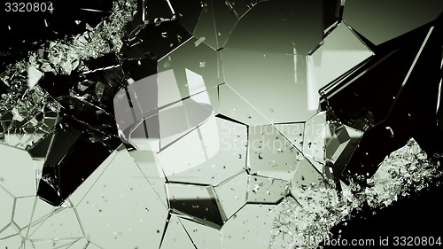 Image of Shattered or cracked glass pieces on black