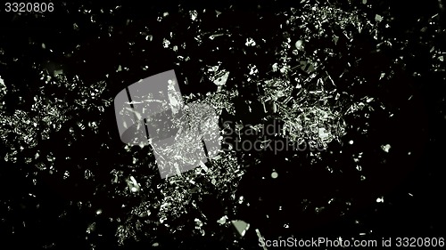 Image of Broken and cracked glass on black