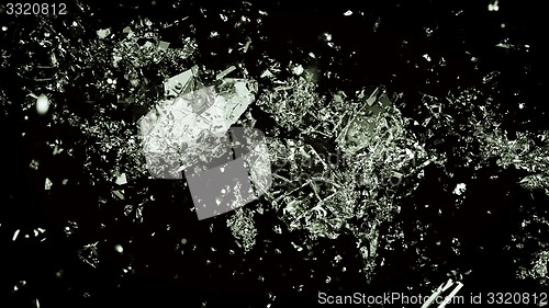 Image of Pieces of splitted or cracked glass on black