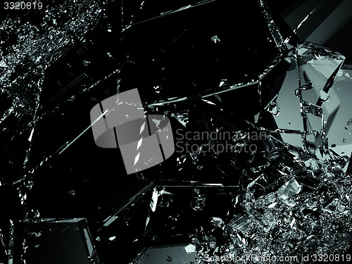Image of Shattered glass pieces on black background