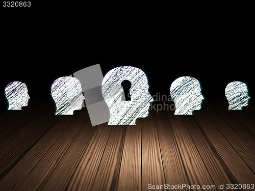 Image of Finance concept: head with keyhole icon in grunge dark room