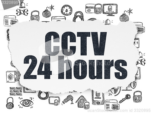 Image of Safety concept: CCTV 24 hours on Torn Paper background